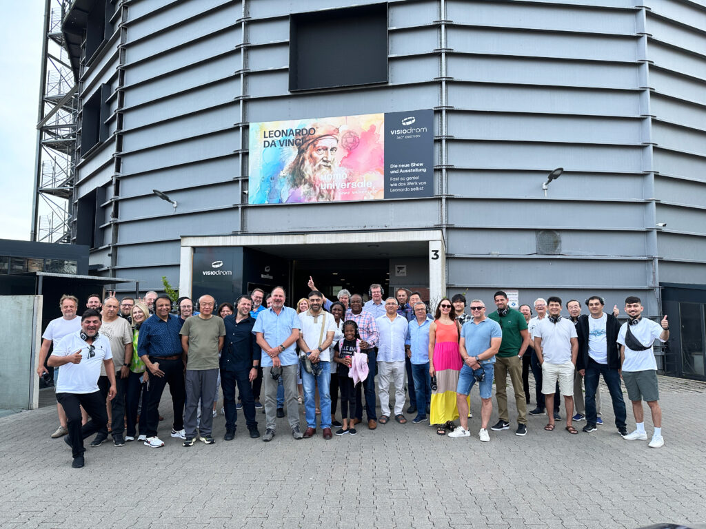 The group in front of the Wuppertal Visiodrom, a location offering projection shows in Wuppertal's oldest gas container